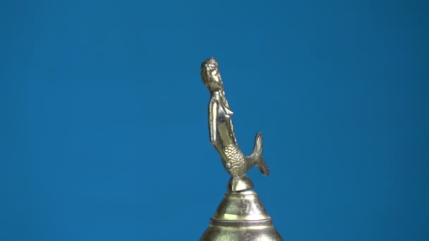 Small vintage brass bell with mermaid sculpture rotating — Stock Video