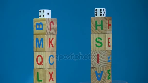 Rotating two alphabetic cube stacks with word Cash and Risk — Stock Video