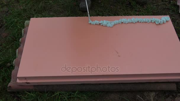 Spraying Fixfoam Glue Pink Polystyrene Block House Foundation Insulation — Stock Video