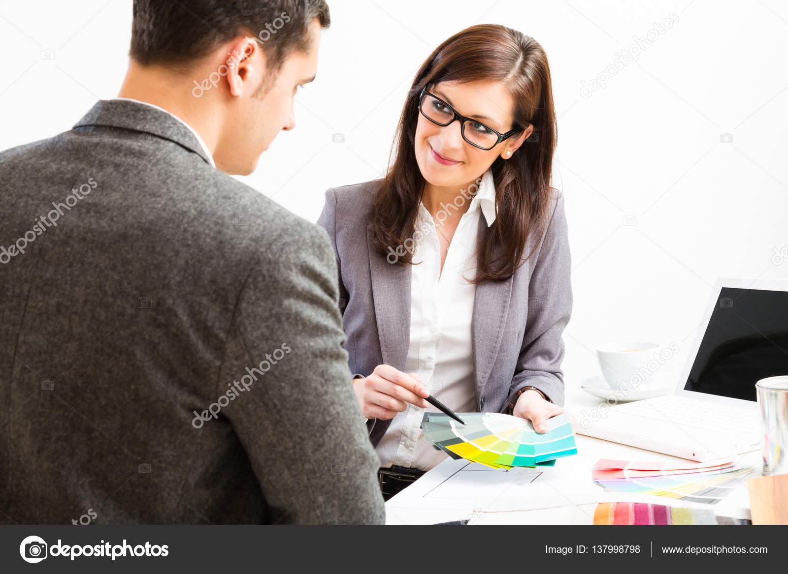 Female Interior Designer With Client Stock Photo