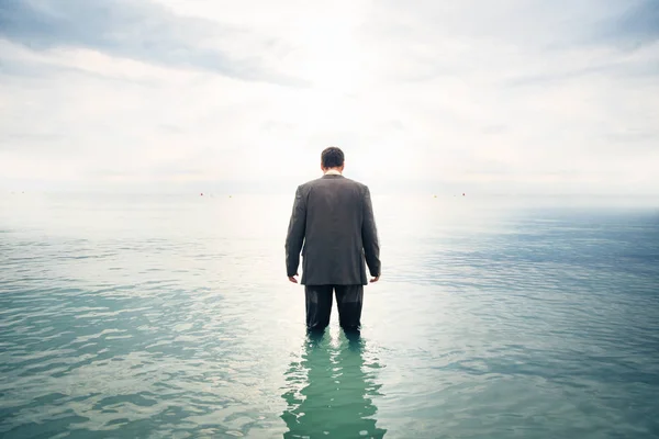 Businessman Knee-deep In Water — Stock Photo, Image