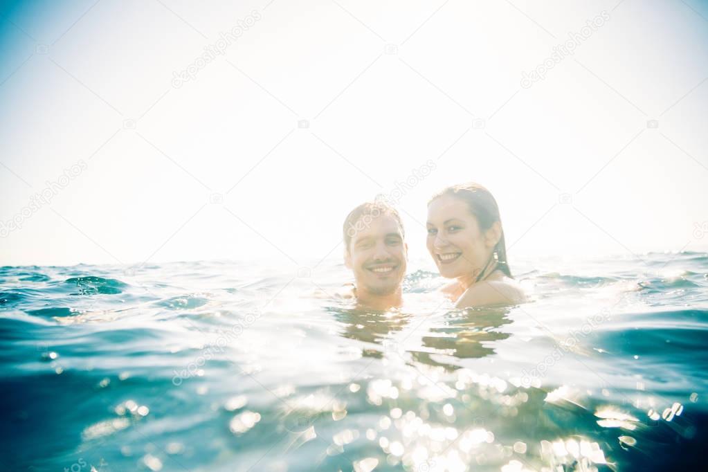 Young Couple Swimming