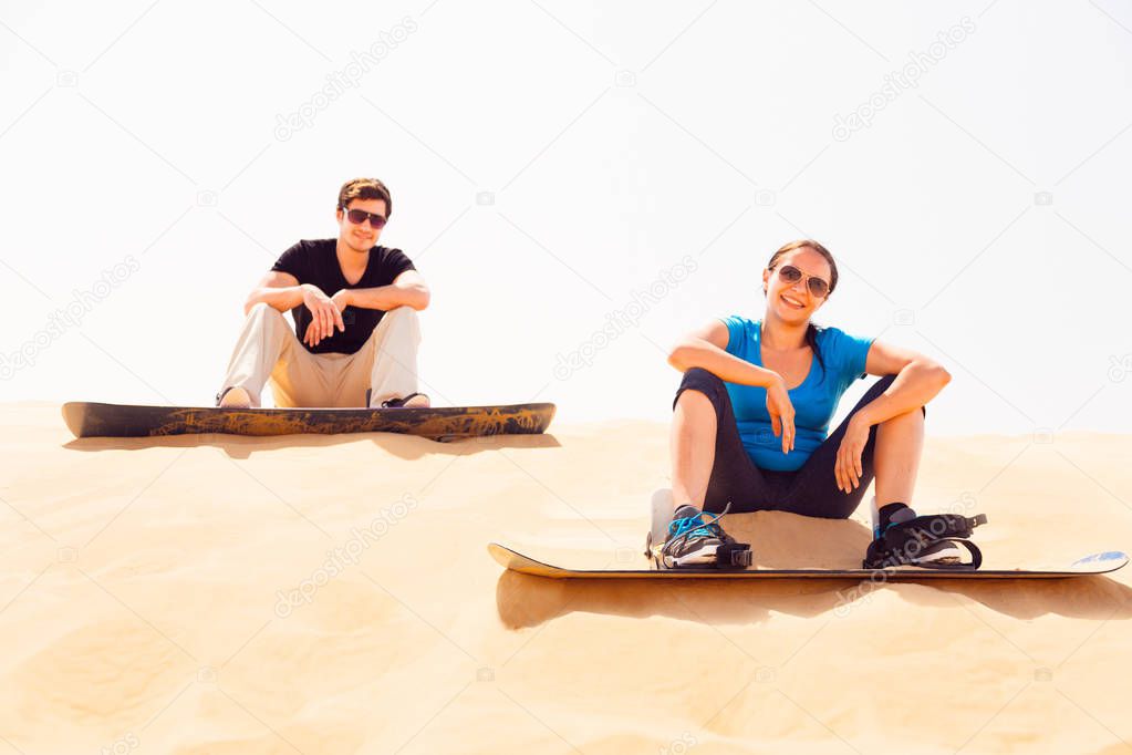 Tourists Sand Skiing In The Desert