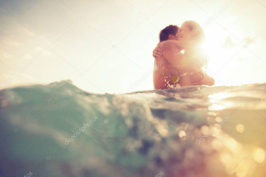 Young Couple Having Fun In The Sea