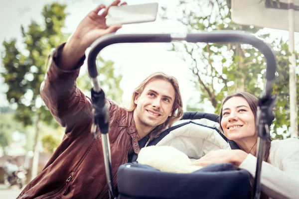 Young Parents Taking Selfies With Their Newborn Baby — Stock Photo, Image