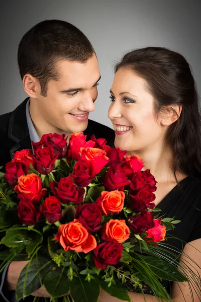 Chic Valentines Couple With Bouquet Of Roses