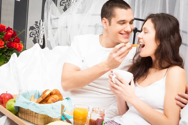 Couple Having Breakfast In Bed Royalty Free Stock Photos