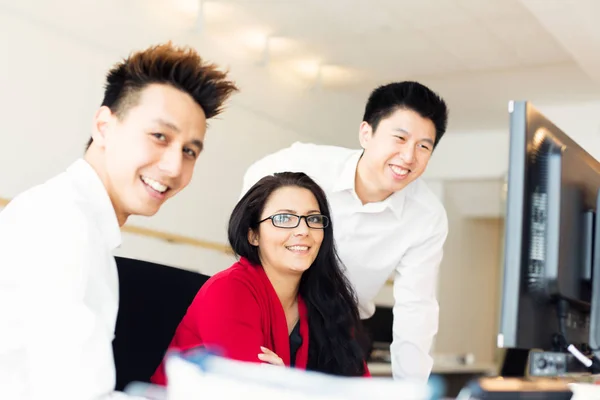 Young Creative Team Working On Their Computer