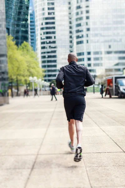 African Man Jogging In Urban Setting