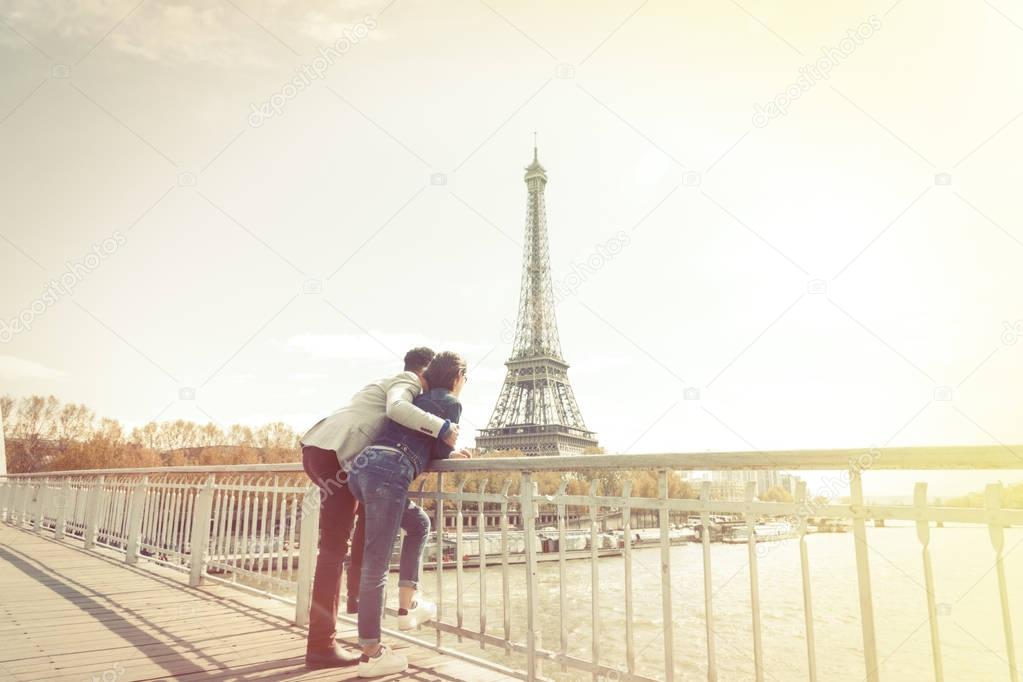 Multi-ethnic Couple Having Fun In Paris Near Eiffel Tower