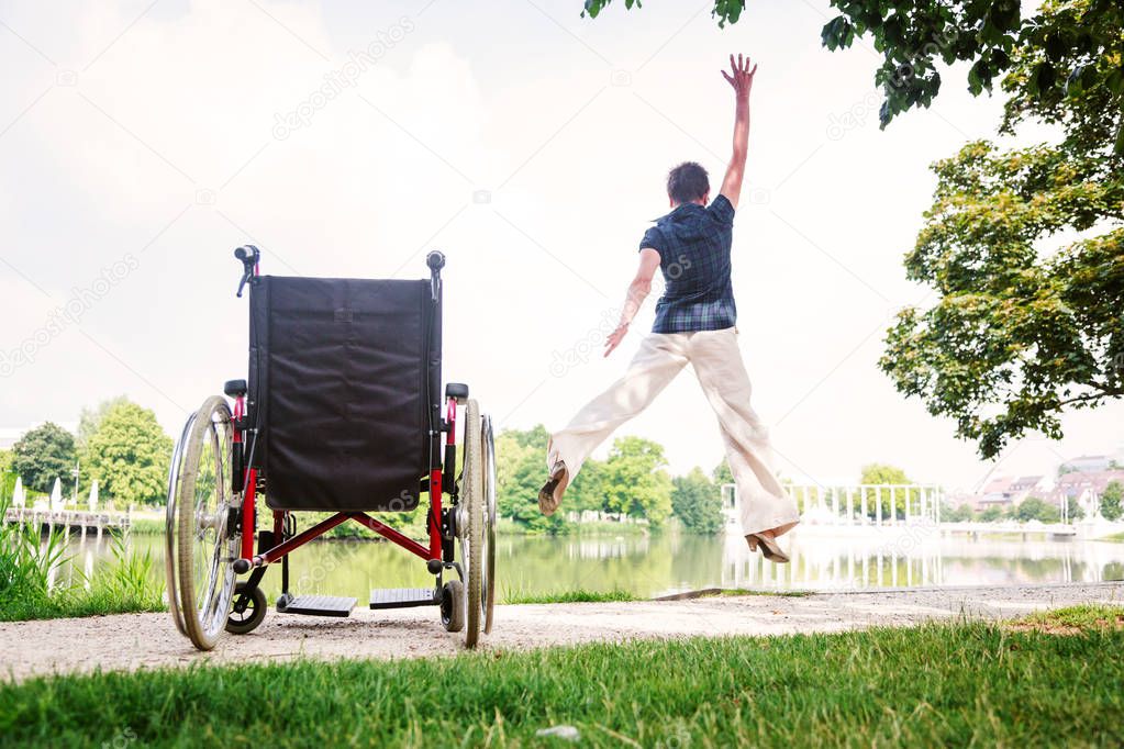 Senior Woman Jumping Up From Wheelchair
