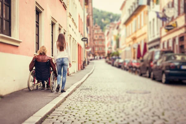 Young Couple In Wheelchair Strolling In The City — Stock Photo, Image