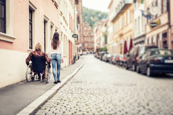 Young Couple In Wheelchair Strolling In The City — Stock Photo, Image