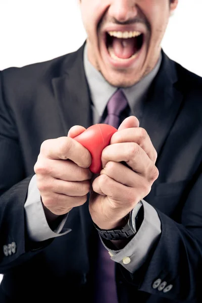 Бизнесмен сжимает мяч стресса — стоковое фото