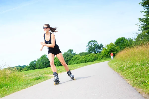 Young Woman With Inline Skates