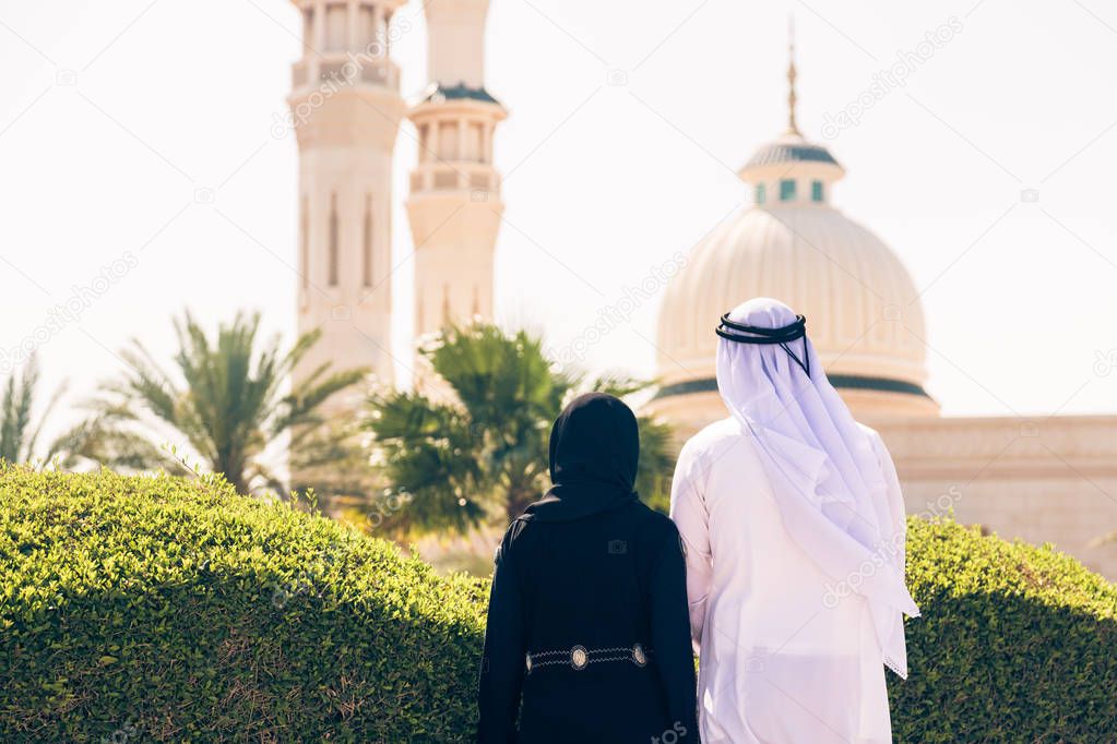 Arabian Couple Standing In Front Of Mosque