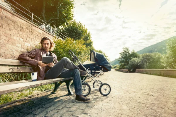 Young Father With Baby Stroller In The Park — Stock Photo, Image