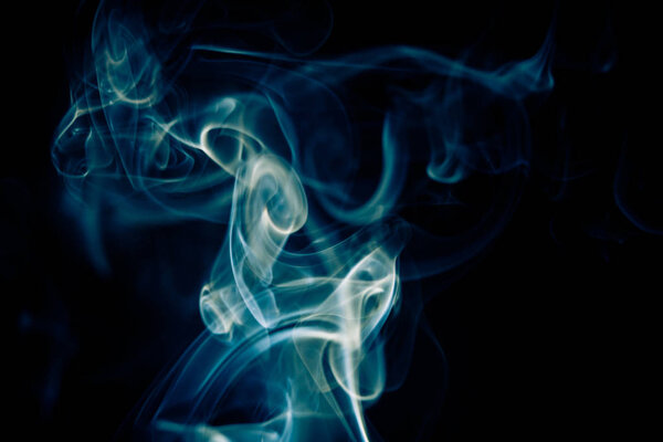 Studio shot of incense smoke on black background