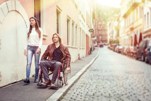 Young Couple In Wheelchair Strolling In The City — Stock Photo, Image