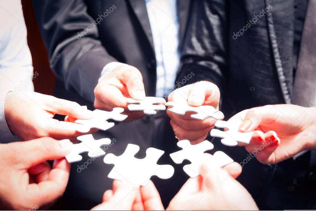 Business Team With Jigsaw Puzzle