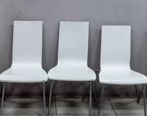 Dirty white chair with metal leg. — Stock Photo, Image