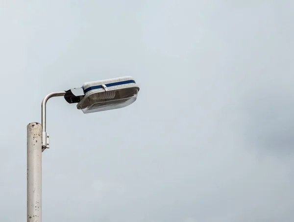 Electrical lamp on the metal pole. — Stock Photo, Image