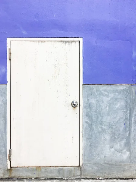 Old metal door behind the warehouse. — Stock Photo, Image