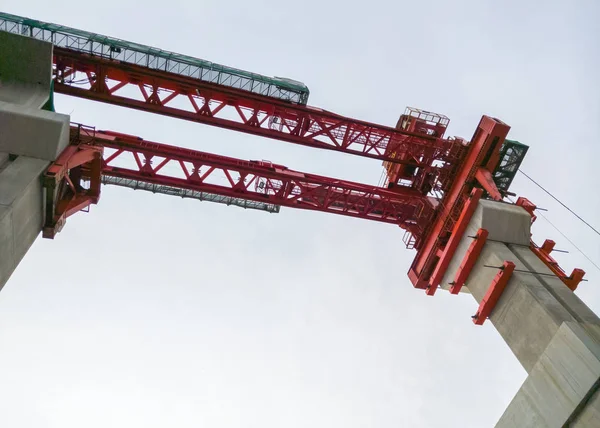 Red crane for construction the train bridge. — Stock Photo, Image