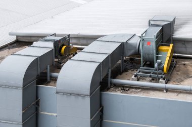 Ventilation system of the air conditioner system of the rooftop of the shopping mall building. clipart