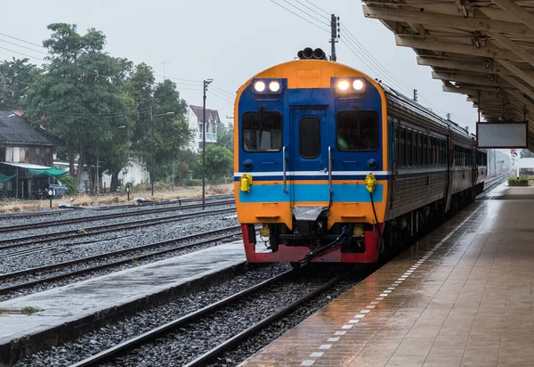 Diesel multiple unit of the special express train is arrival to the urban station in the evening, Air-conditioned power diesel railcar (with driving cab).