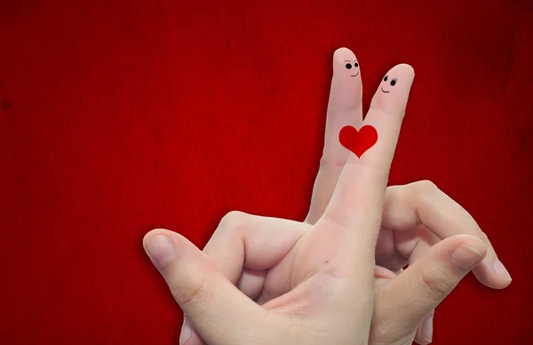 Finger und ein bemaltes Herz — Stockfoto