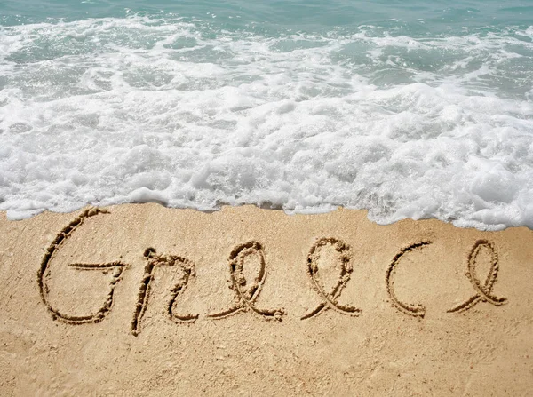 Handwritten Greece text in sand — Stock Photo, Image