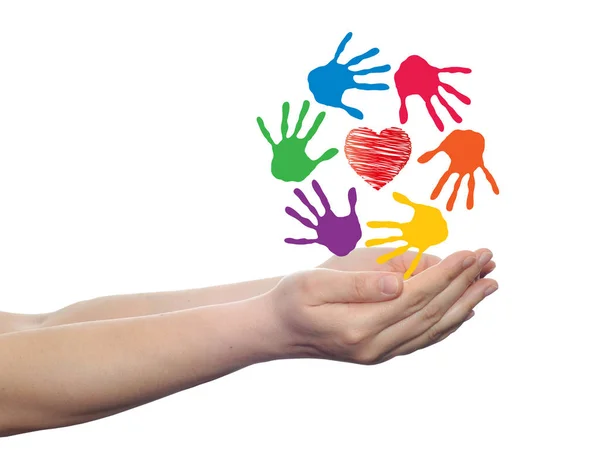 Heart symbol with circle of handprints — Stock Photo, Image