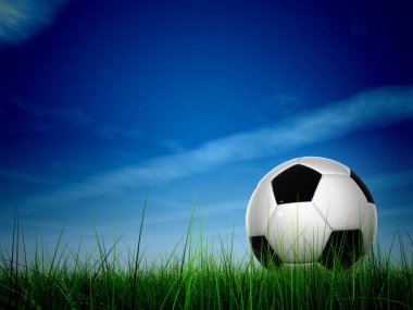 Yeşil çimlerde futbol topu