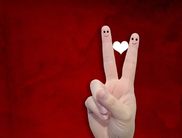 Fingers with heart and faces — Stock Photo, Image