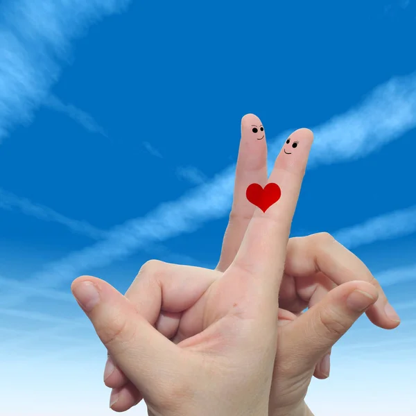 Fingers with heart and faces — Stock Photo, Image