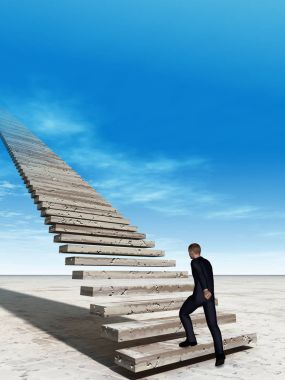 İş adamı merdivenlerde yürüyor