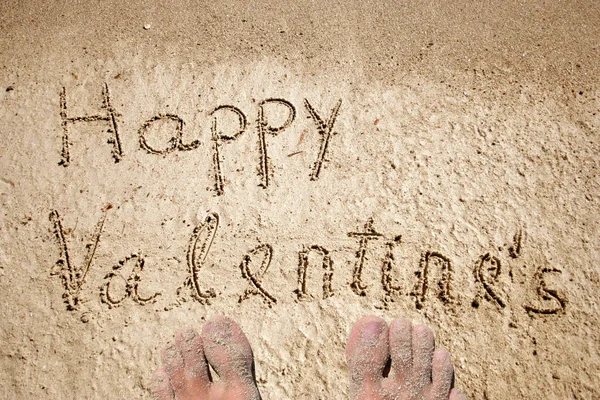 Sabbia su uno sfondo spiaggia con i piedi — Foto Stock