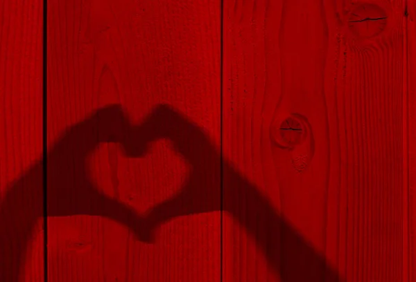 Sombra de manos en forma de corazón — Foto de Stock