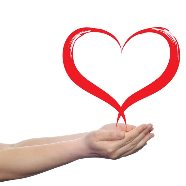 Símbolo rojo del corazón en las manos — Foto de Stock