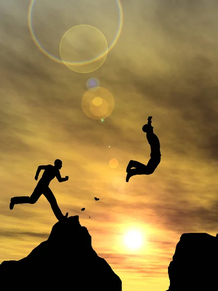 Männliche Silhouetten springen über Felsspalte — Stockfoto
