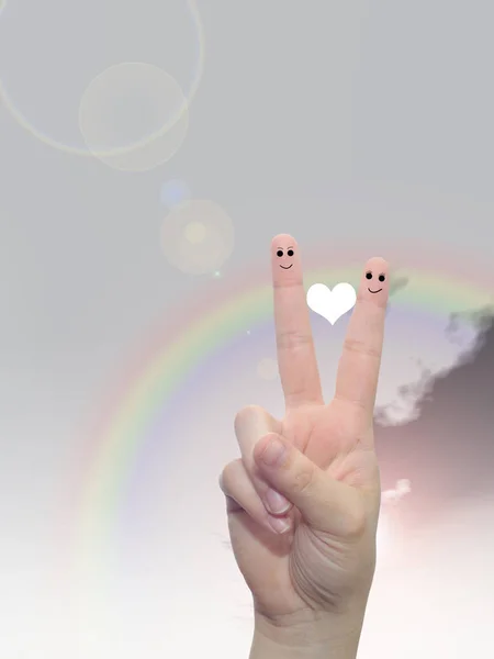 fingers with red heart and smiley faces