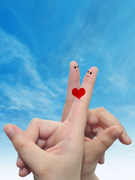 Fingers with red heart and smiley faces — Stock Photo, Image