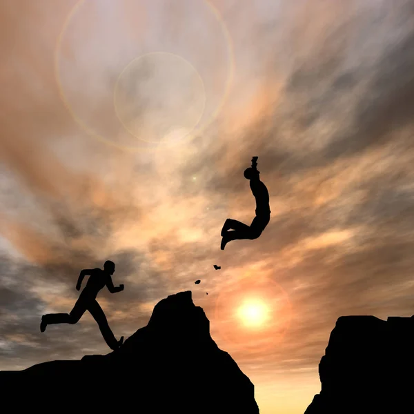 Businessman silhouette jump from cliff — Stock Photo, Image