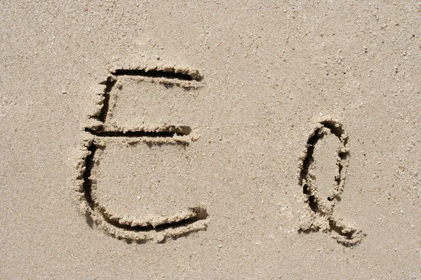 Concept or conceptual sand font or letter set group or collection carved on exotic beach near sea isolated on a sandy background, metaphor to nature, natural, education, character, message or summer — Stock Photo, Image