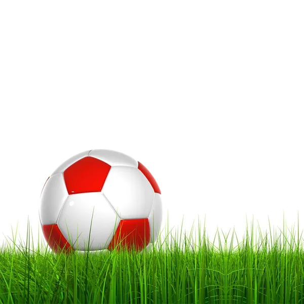 Зеленая трава с футбольным мячом — стоковое фото