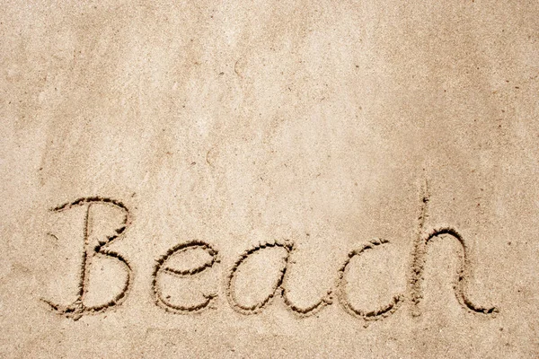 Playa escrita a mano en arena — Foto de Stock