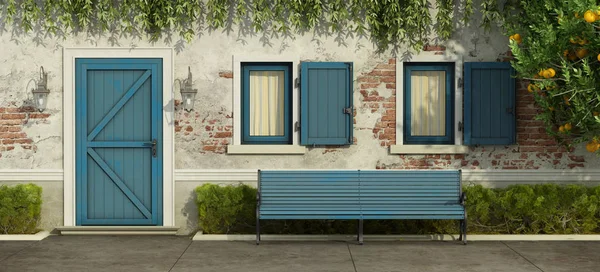 Old house with blue door and windows — Stock Photo, Image