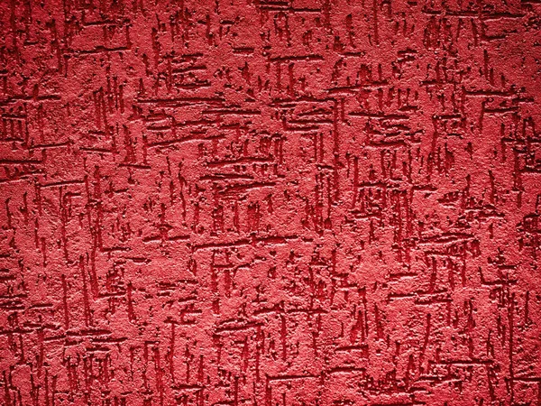 Detail of a textured, red exterior wall