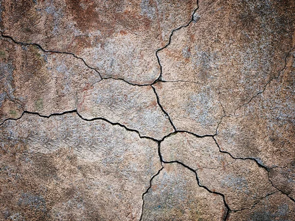 brown background, dark wall texture with cracks on the surface
